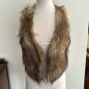 H&M fur vest for young girls.   Only worn once